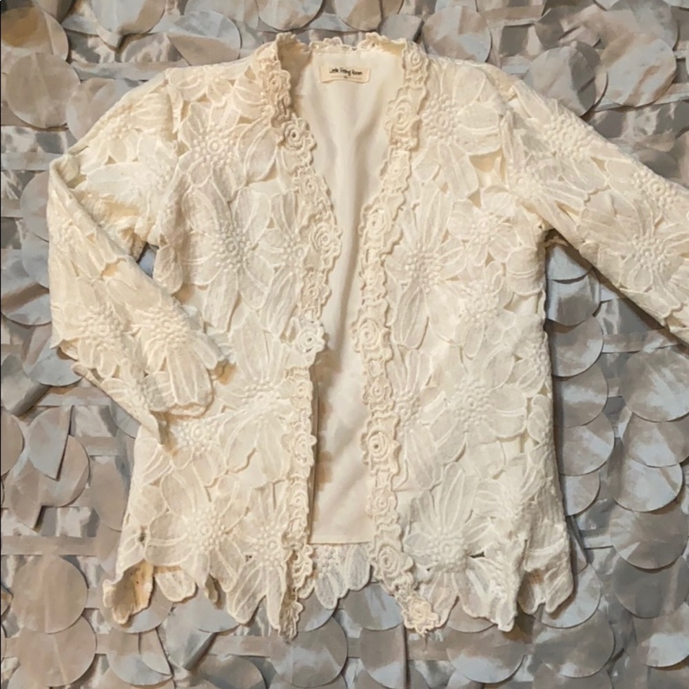 Beautiful white lace jacket for girls.